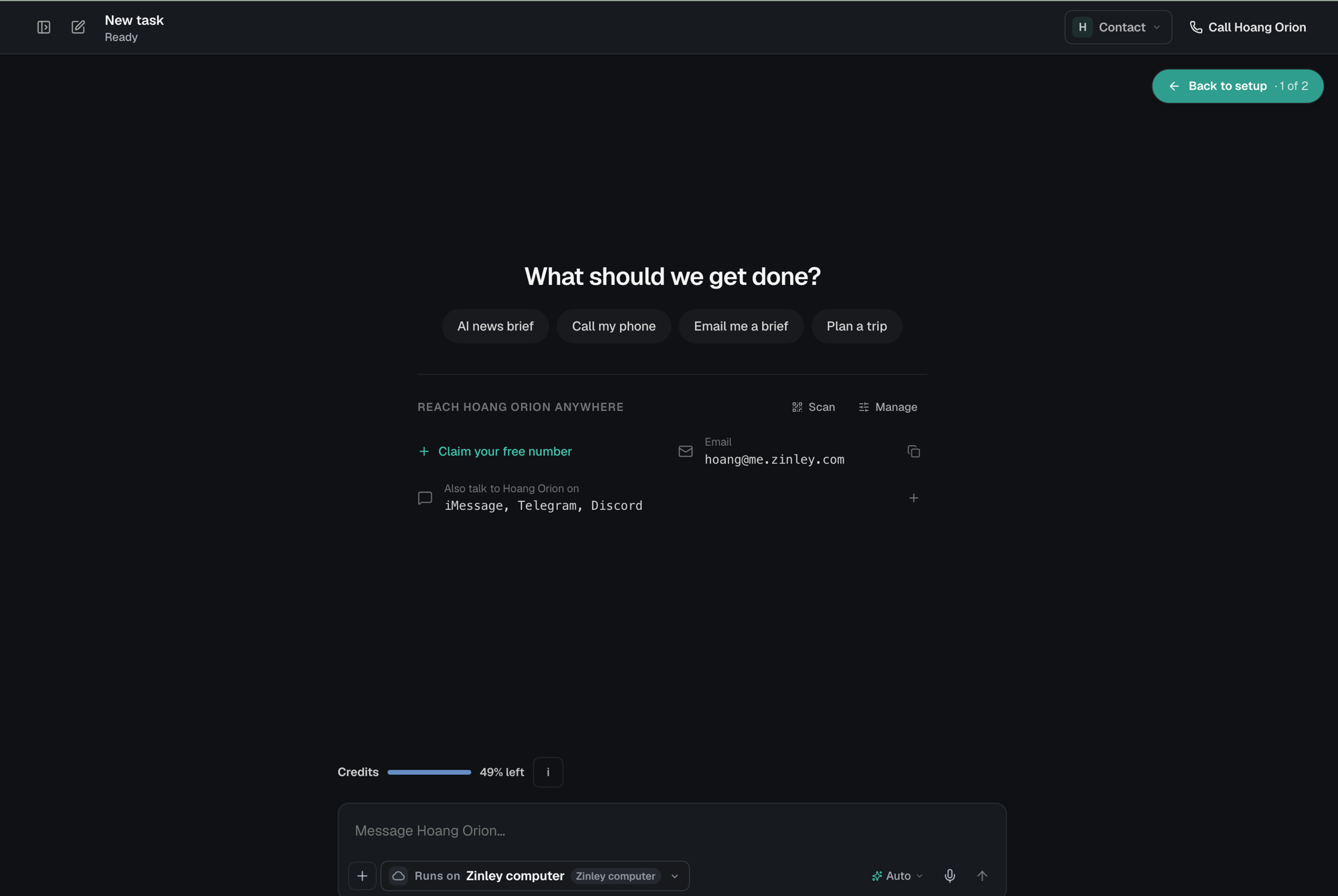 The new-task screen with a Reach your agent anywhere card: Claim your free number, the agent's email address, and a row reading Also talk to your agent on iMessage, Telegram, Discord, with Scan and Manage buttons above.